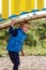 A little cute boy plays under a beautiful, curved bridge on a colorful playground. Vertical photo