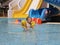 Little cute boy in the summer swims in the pool