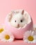 little cute Bunny in an Easter egg among daisies on a pink background