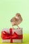 Little cute chickens playing next to gift box with ribbon,