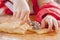 Little cute child girl chef cuts the dough and making handmade cakes. Food, Ñooking process, sweets concept. Selective focus