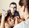 Little cute child making facepaint on birthday party, zombie Apocalypse facepainting, halloween preparing concept