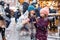 Little cute daughter and mother with cup of steaming hot chocolate or children punch