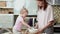 Little cute funny girl helping mother prepare pie cake in kitchen, baking homemade cookie together, happy family time.