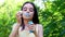 Little cute girl blowing soap bubbles