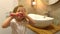 Little cute girl brushing her teeth in the bathroom