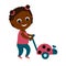 A little cute girl is carrying a toy ladybug on wheels and a cane. The child is smiling and she is happy.