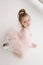 Little cute girl in class in ballet studio