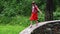 Little cute girl climbs and runs on stone wall