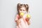 Little cute girl eating apple. inscription Go Vegan