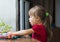 Little cute girl playing table play outside