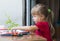 Little cute girl playing table play outside