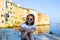 Little cute girl  posing on the embankment of Rovinj town, Croatia.