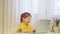 Little cute girl smile use laptop. Smart little girl talking with screen. child learns the language online. The girl