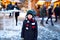 Little cute kid boy having fun on German Christmas market. Happy child on traditional family market in Germany, Laughing