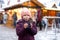 Little cute kid girl with cup of steaming hot chocolate or children punch. Happy child on Christmas market in Germany