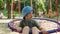 Little Cute Preschool Baby Boy in Panama Hat Ride on Hanging Hammock Swing on Playground in Public Park. Children Have