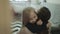 Little daughter rushes into mother`s arms at home and gives her a big hug.