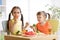 Little discontented children does not want to eat pasta with vegetables