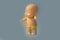 Little doll toy on blue background is isolate