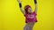 Little energetic caucasian girl in pink sportswear making fit dance, modern aerobic dancer