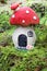 Little fairy mushroom house on a mossy forest background