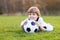 Little fan boy at public viewing of soccer or football game