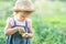 Little farmer child - lovely girl with picked vegetables