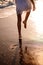 Little feet leave footprints on sandy shore of sea. walks on beach