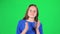 Little female is clapping her hands and then shows thumbs up. Greenscreen. Slow motion