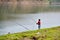 Little fisherman by the lake