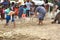 Little fishermen team with net trying caught fish