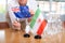 Little flag of Iran on table and flag of Australia put next to it by young woman