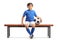 Little footballer sitting on a bench