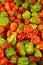 little fresh peppers from market Red, yellow, and green bell peppers capsicum background vertical