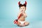 Little funny baby with devil horns and trident