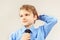 Little funny kid straighten tie over bright blue shirt