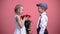 Little gentleman boy presenting bouquet of roses to young lady, Valentines day