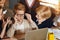 Little ginger boy in glasses trying to remember his parents` key word of laptop