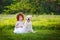 LIttle ginger girl and big dog bestfriend on nature background