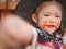 Little girl, 3 years old, is happy with her Halloween makeup and pretend playing as a powerful witch