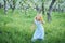 Little girl 5 years old sniffing a dandelion