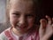 Little girl 6-7 years old has lost lower milk teeth. Cute preschooler child smiling wobbling her tooth
