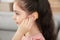 Little girl adjusting hearing aid