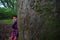 Little girl and ancient camphor tree-Cinnamomum camphora