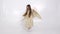 Little girl with angel wings dancing on a white background.