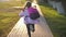 Little girl with a backpack run to school. School and kindergarten education concept. Back view, slow motion and