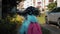 Little girl with a backpack run to school. School and kindergarten education concept. Back view, slow motion and