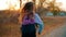 Little girl with a backpack run to school. School and kindergarten education concept. Back view, slow motion and