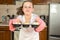 Little girl bakes muffins at home ,